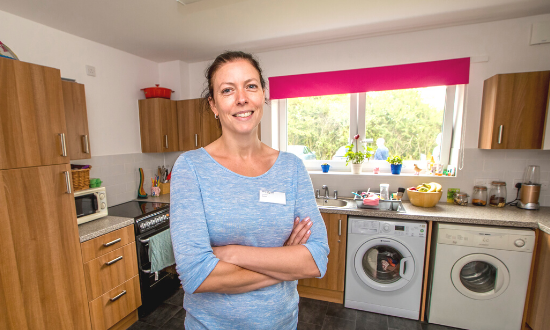 Resident in her kitchen