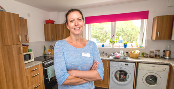 Resident in her kitchen